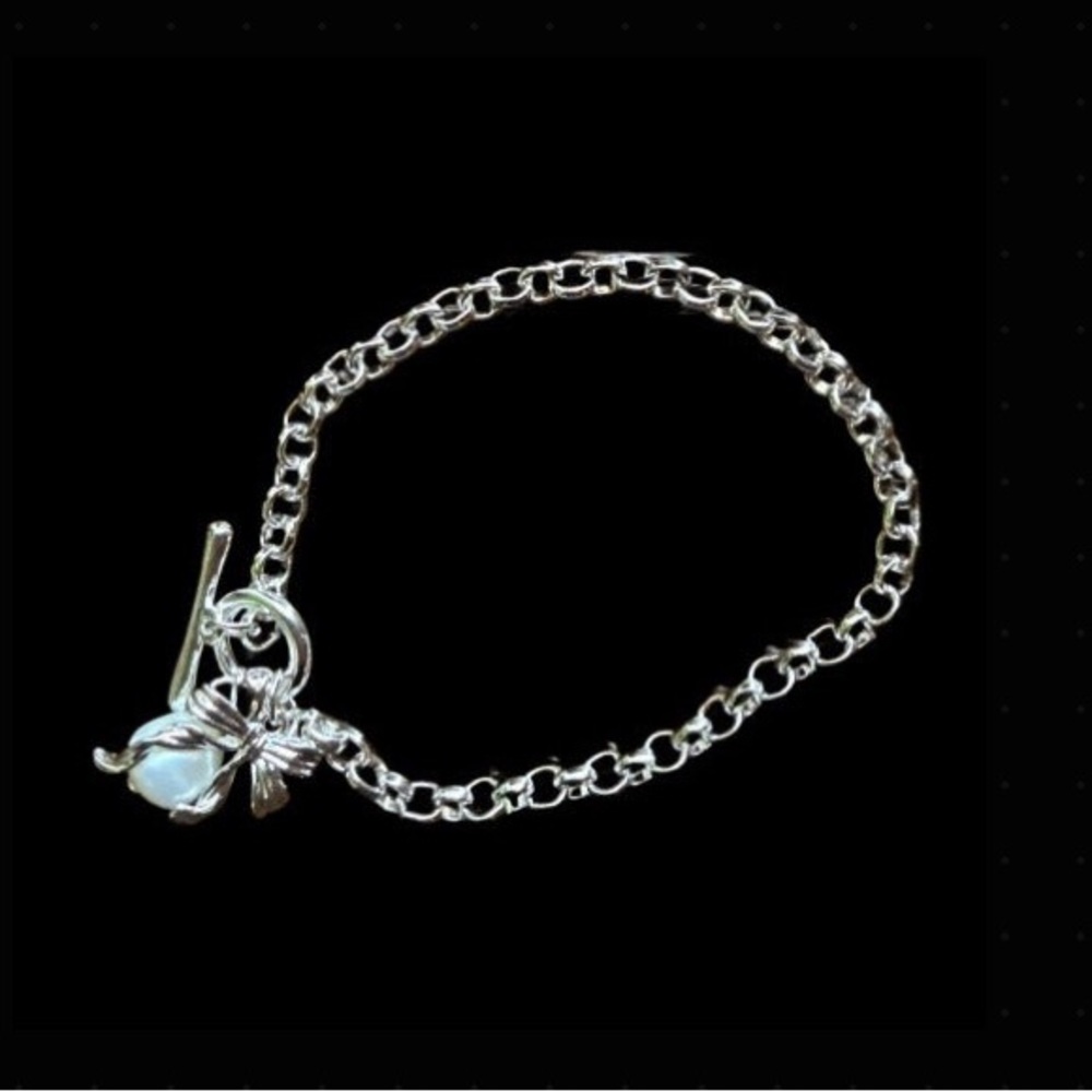 Elegant Silver tone Bracelet with Bow and Pearl Charms - Picture 2 of 6